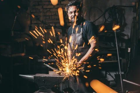 Man using angle grinder sparks Stock Photos