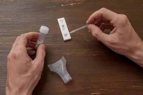 Man using antigen covid test Stock Photos