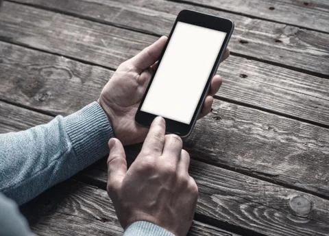 Man using app on a smartphone display Stock Photos