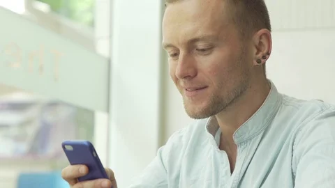 Man using app on smartphone Stock Footage 79093173