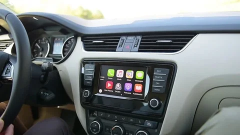 Man using Apple CarPlay in modern car connected to main system Stock Footage