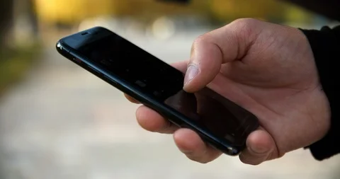 Man Using Apple iPhone XS Side View Shot Stock Footage 95619642