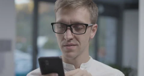 Man using apps on his smartphone Stock Footage 168372223