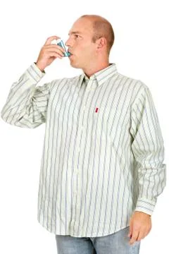 Man using asthma pump 스톡 사진