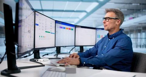 Man Using Automatic Salary Calculator Software For Tax Accounting Business. Stock Photos