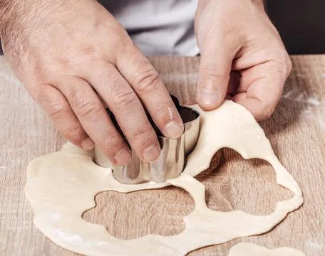 Man using bakery mold for cookies Stock Photos