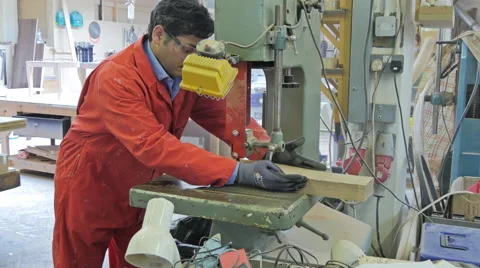 Man Using a Bandsaw Machine, Side Shot Video stock 40333944