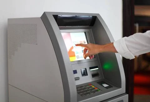 Man using banking machine Man using banking machine. Close up ,model relea... Foto stock