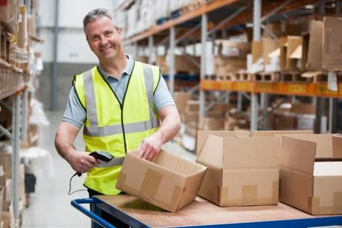 Man using barcode reader in warehouse Stock Photos