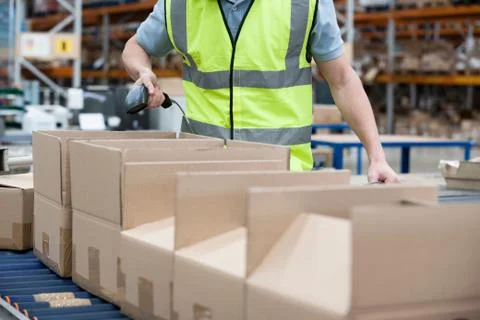 Man using barcode reader in warehouse Stock Photos