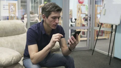 Man Using Black Smartphone in the Office Stock Footage 74794035