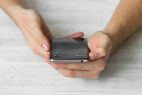 Man using black smartphone a touch screen smart phone in cafehands close up, Foto stock