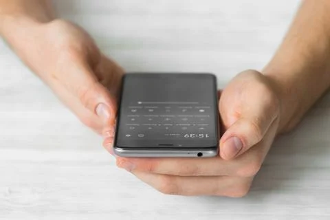 Man using black smartphone a touch screen smart phone hands close up, vintage 스톡 사진