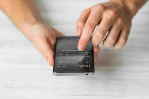Man using black smartphone a touch screen smart phone hands close up, vintage Stock Photos
