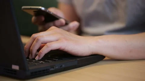 Man using both laptop and smartphone at the same time. Stock Footage 51709326