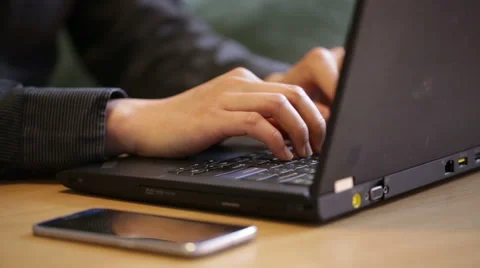 Man using both laptop and smartphone at the same time. Stock Footage 51709329