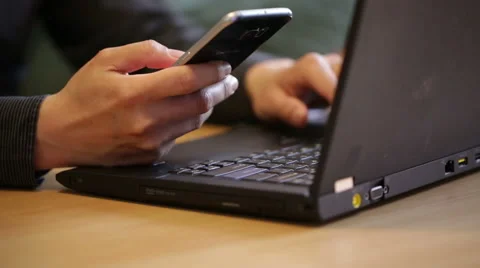 Man using both laptop and smartphone at the same time. Stock Footage 51709331
