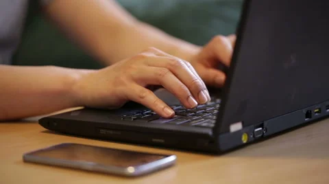 Man using both laptop and smartphone at the same time. Stock Footage 51709332