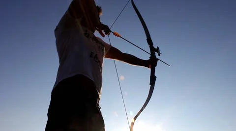 Man using bow and arrow, low angle Stock Footage 40954339