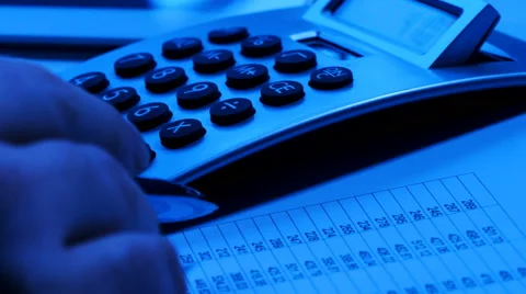 Man using calculator at desk, blue toned Stock Footage 61817287