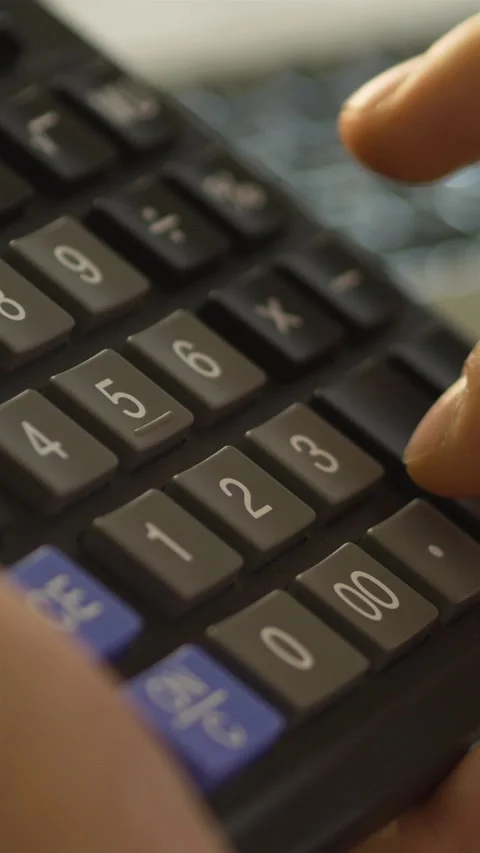 Man Using Calculator For Financial Planning. Vertical Stock Footage 272179210