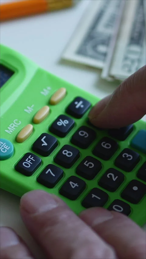 Man Using Calculator For Financial Planning. Vertical Stock Footage 276496199