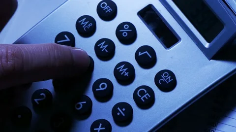 Man using calculator, overhead rotation Stock Footage 61819407