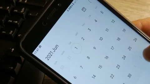 Man using calendar app on the mobile device. Male hands scrolling on smartphone. Stock Footage 126774180