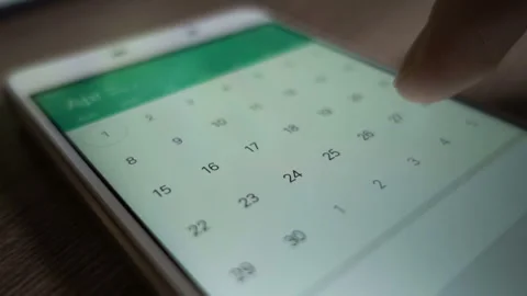 Man using calendar app on the mobile device closeup. Close-up male hands Stock Footage 252723515