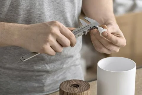 Man using caliper in workshop Stock-Fotos