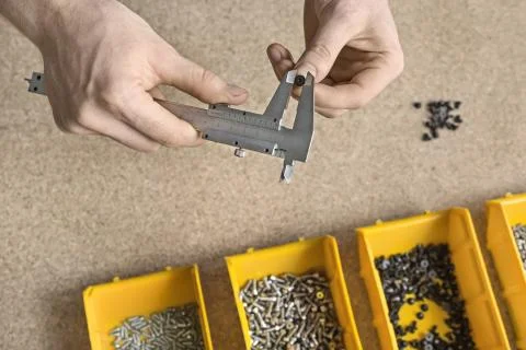 Man using caliper in workshop Stock Photos