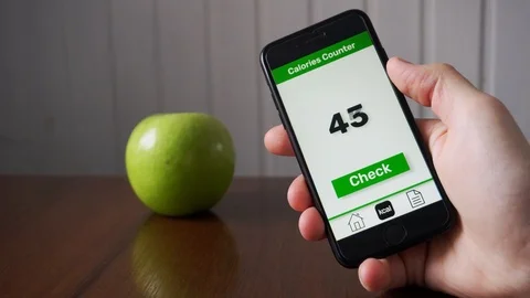 Man using calorie counting app on the smartphone Stock Footage 109404384
