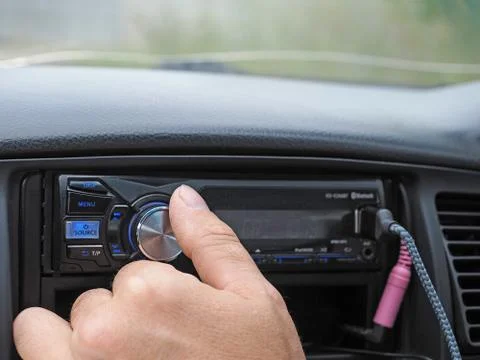 Man using car audio stereo magnet Stock Photos