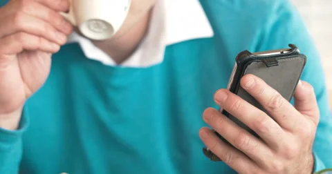 Man using cell phone and making notes Video stock 57139021