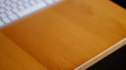 A man using a cell phone at his desk. 스톡 동영상 76784572