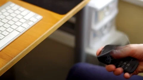 A man using a cell phone at his desk. Stock Footage 76784575