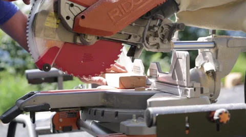 Man using Chop Saw outside on a construction site Stock Footage 65092909