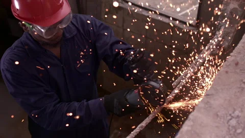 Man Using Circular Angle Grinder on Metal Stock Footage 248795957
