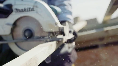 Man using Circular Saw for cutting wood Stock Footage 77679788