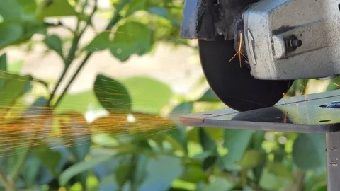 Man using circular saw cutting metal Stock Footage 88491562