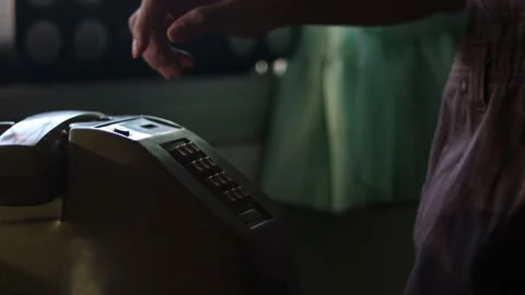 Man using an classic telephone and listening to the radio by the window. Stock Footage 170531736