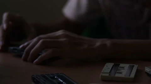 Man using an classic telephone and listening to the radio by the window. Stock Footage 170531743