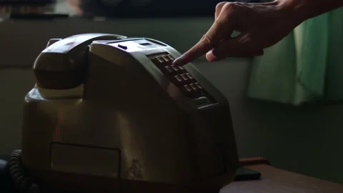 Man using an classic telephone and listening to the radio by the window. Stock Footage 170541821