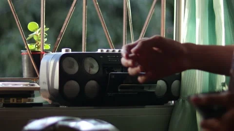 Man using an classic telephone and listening to the radio by the window. Stock Footage 170542045