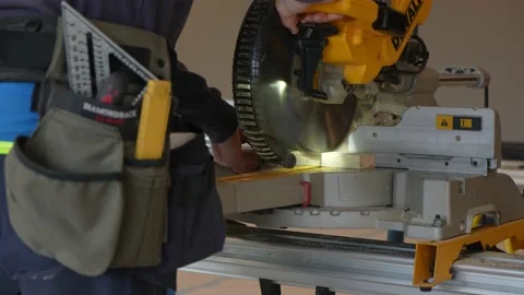 Man using a compound miter saw Stock Footage 201928058