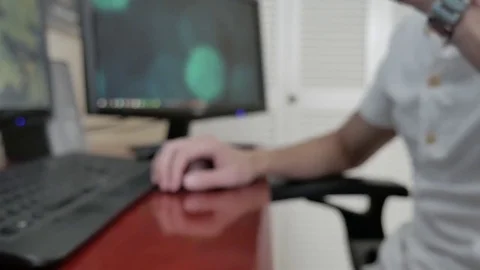 A man using a computer and drinking a coffee Stock Footage 75484430