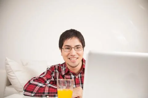 Man using the computer  and looking at camera Фото