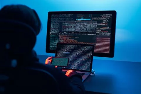 Man using computer and programming  to break code. Cyber security threat. I.. Foto stock