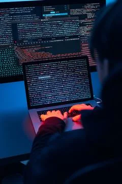 Man using computer and programming  to break code. Cyber security threat. I.. Stockfoto's