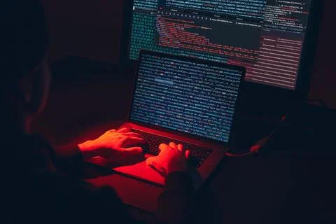 Man using computer and programming  to break code. Cyber security threat. I.. 写真素材